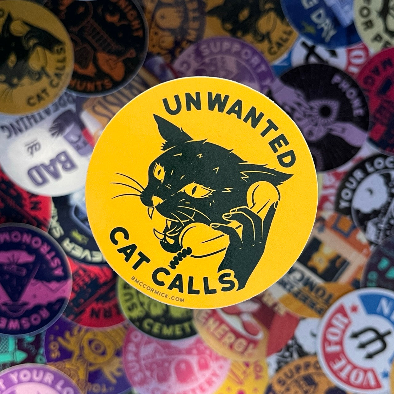 Round sticker with black cat and Unwanted Cat Calls text