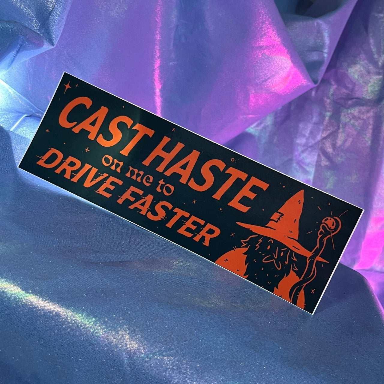 Bumper sticker with wizard and Cast Haste on Me to Drive Faster text
