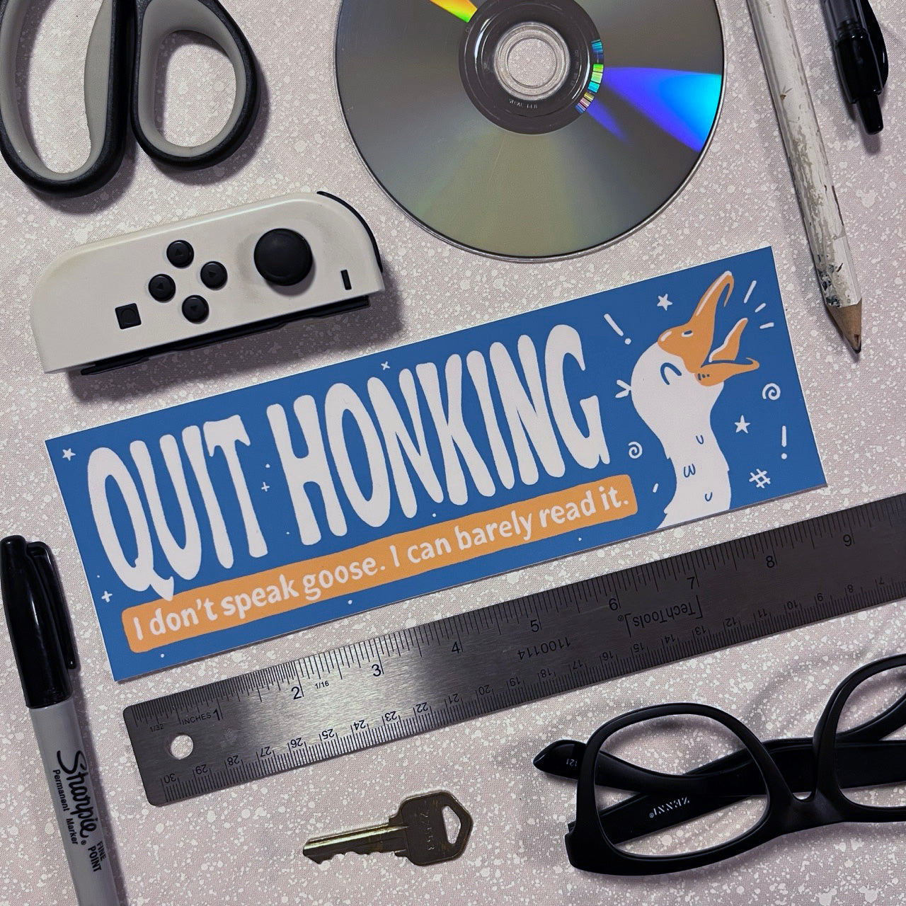Bumper sticker with honking goose and Quit Honking I Don't Speak Goose text