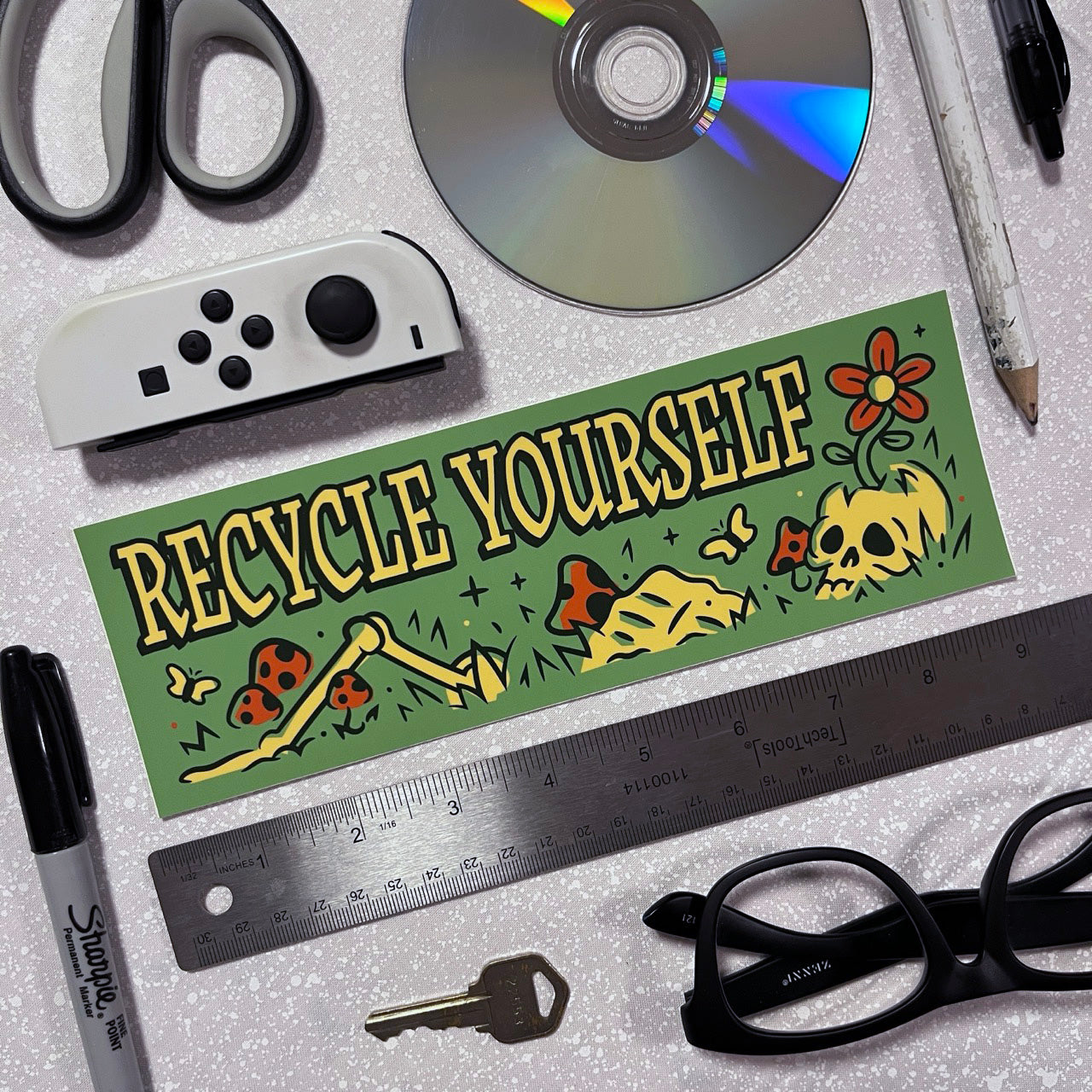 Bumper sticker with skeleton says Recycle Yourself