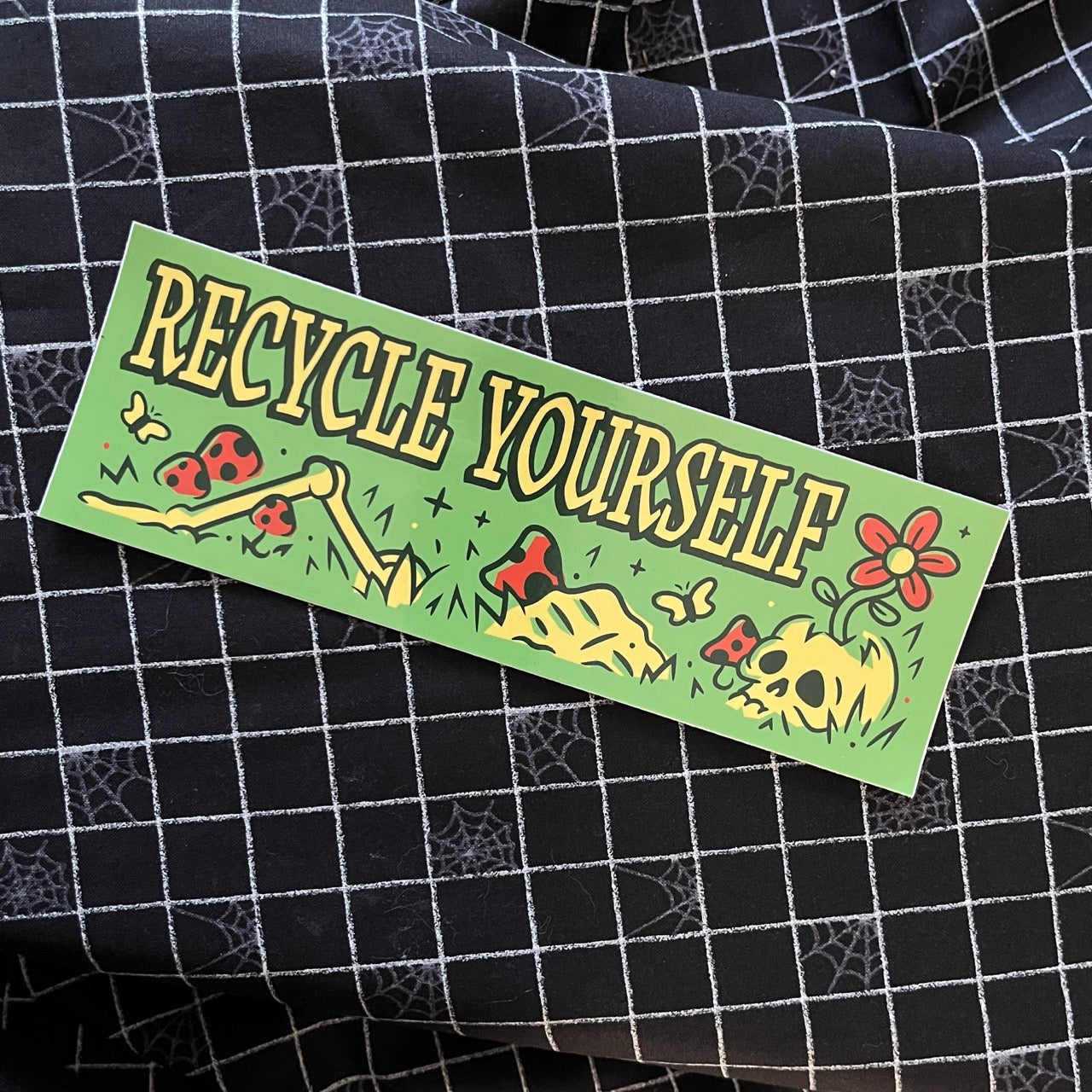 Bumper sticker with skeleton says Recycle Yourself