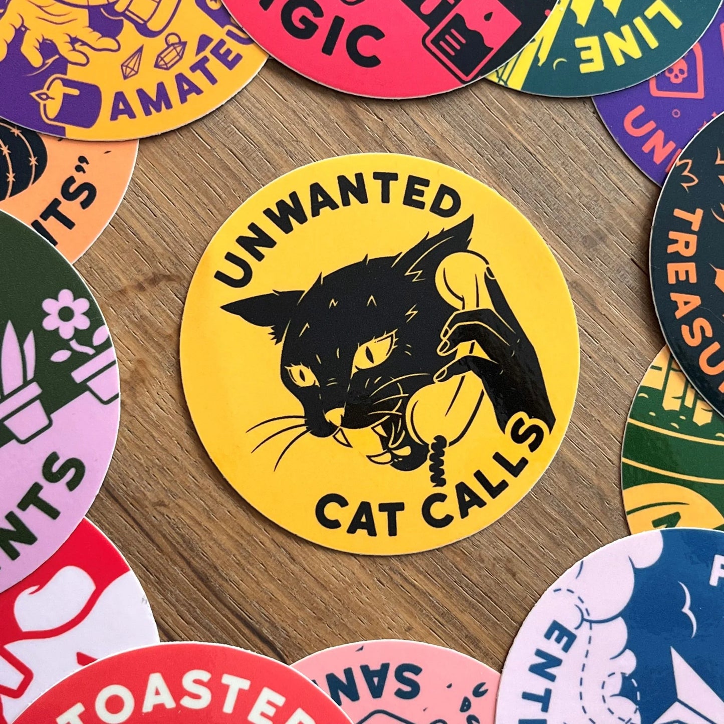Round sticker with black cat and Unwanted Cat Calls text
